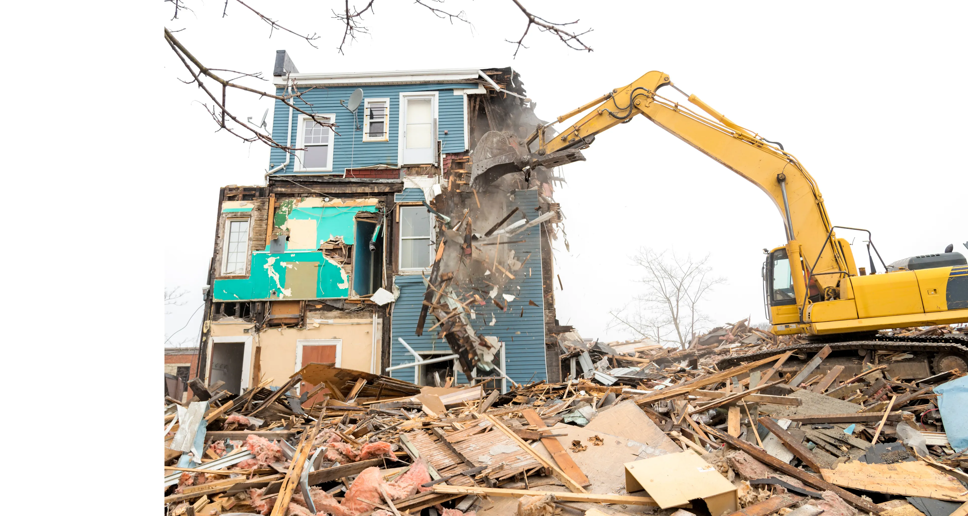 Excavator performing structural demolition on a residential building in Dallas, TX