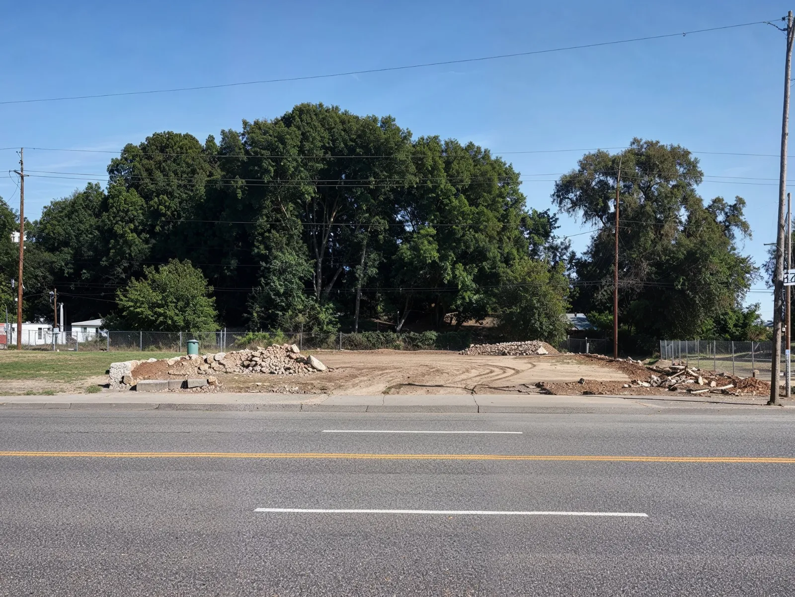 Commercial building demolition project in Dallas TX showing cleared lot after structure removal in urban area