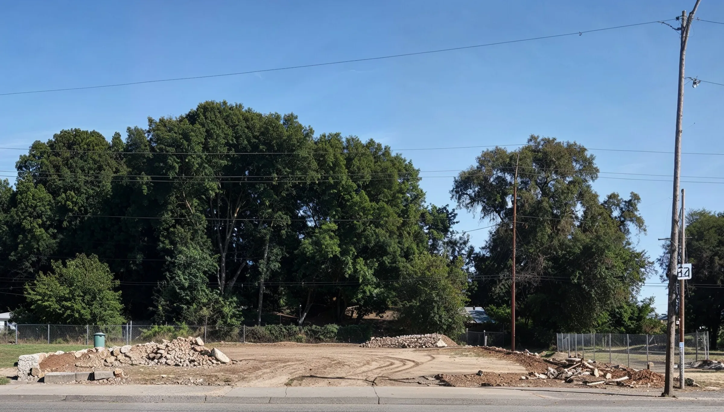 Commercial demolition project in Dallas TX showing fully cleared lot after building removal and debris cleanup