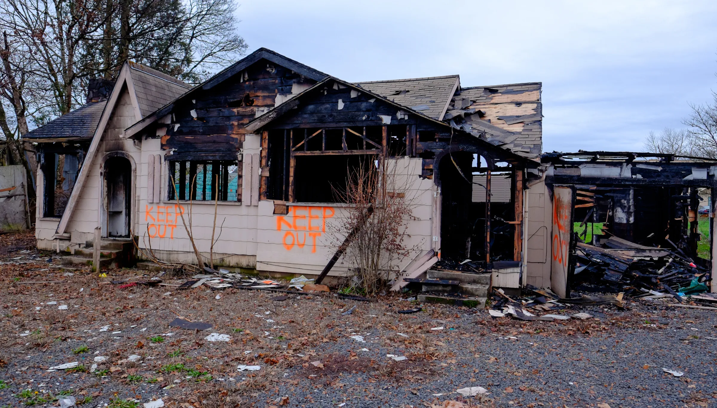 Fire damaged house in Dallas TX requiring emergency demolition due to unsafe structure conditions